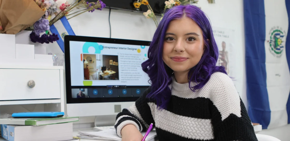 Student wearing a stripped sweater
