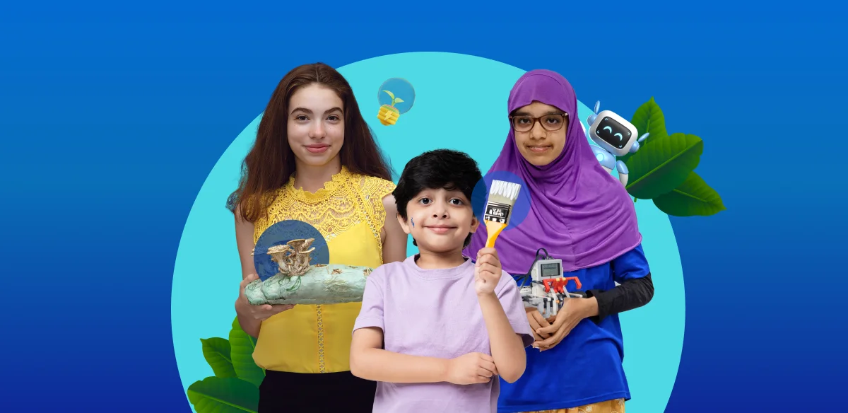 Three students smiling at the camera