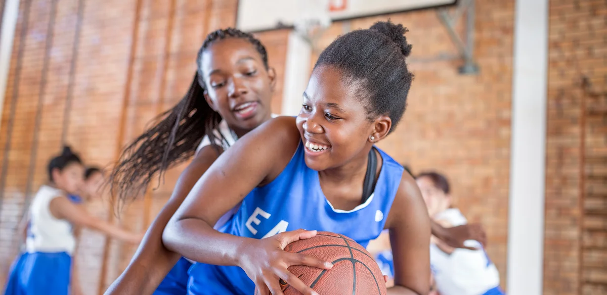 Students playing basket
