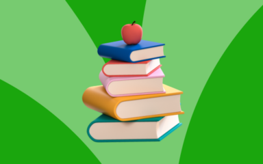 Stack of colorful books topped with a red apple against a green background representing virtual learning and education.